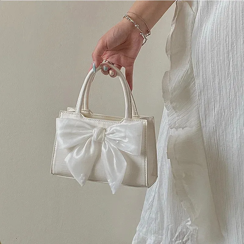 Chic & Compact: Lightweight Shoulder Bag with Bow Detail