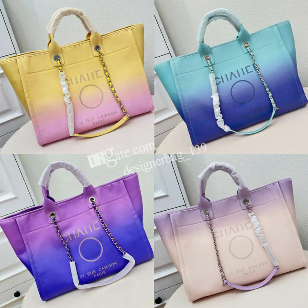 Bolsas de designer de bolsas de luxo Bolsa de praia Chave de vaca de grande capacidade Mulheres de compras Bolsa Rainbow Canvas de praia