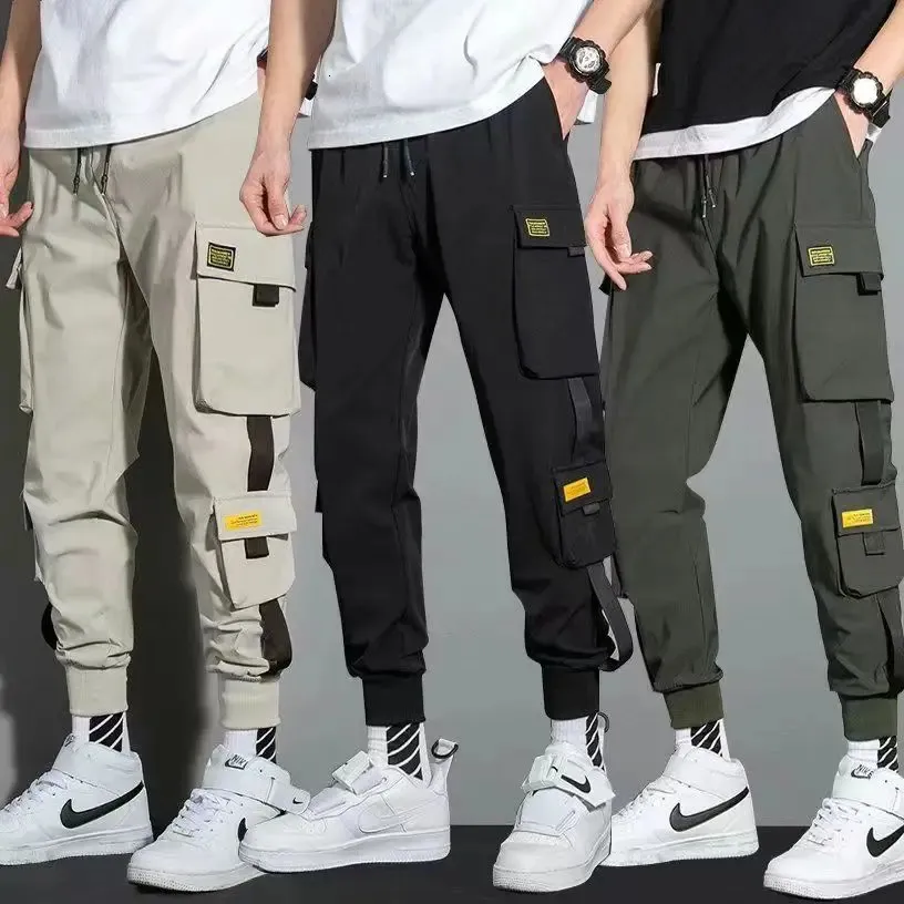 Pantaloni casual da uomo streetwear sottili Nastri da uomo Pantaloni da jogging Harem Pantaloni cargo da uomo slim fit primaverili Pantaloni multi-tasche da donna Jx1 240228