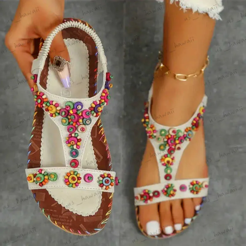 Sandaler Lucyver pärlor Flower Flat Heeled Sandals Women Summer 2023 Plus Size Open Toe Bohemian Sandals Woman Elastic Strap Rome Shoes T240302