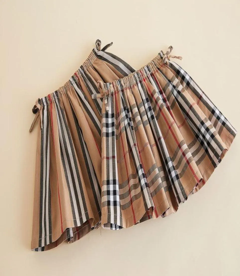 Preppy Style Girls Plaid kjol 2022 Barn bågar Elastiska randkjolar Kids Bomullsgitter Pleated Clothing A81503622210