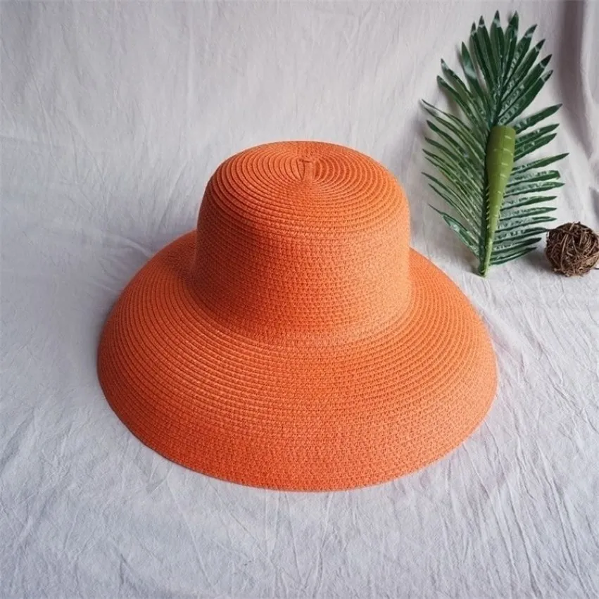 Cappello parasole vintage da donna in puro colore stile Hepburn per le vacanze 5658CM Temperamento elegante moda estiva cappello di paglia di alta qualità 2205285Q