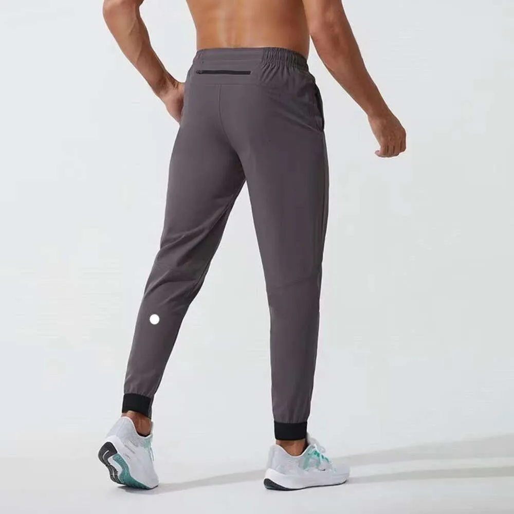 Ll Мужские длинные брюки для бега Спортивный костюм для йоги Быстросохнущие спортивные штаны с карманами на шнурке Спортивные штаны Брюки Повседневная эластичная талия Fiess Lululemens 9913ess