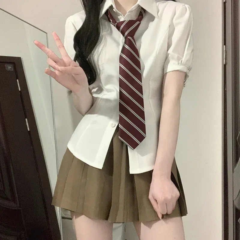 Ternos japão coreano menina jk uniforme define estilo universitário mangas puff camisa bandagem fina feminino camisa de manga curta saia plissada terno