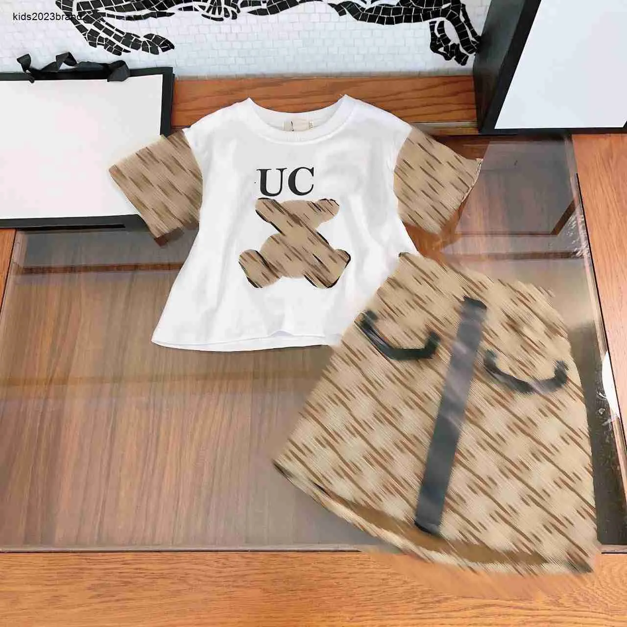 New kids dress summer Two piece suits Little Bear Pattern child tracksuits Size 110-160 CM T-shirt and Grid letter printed short skirt 24Mar