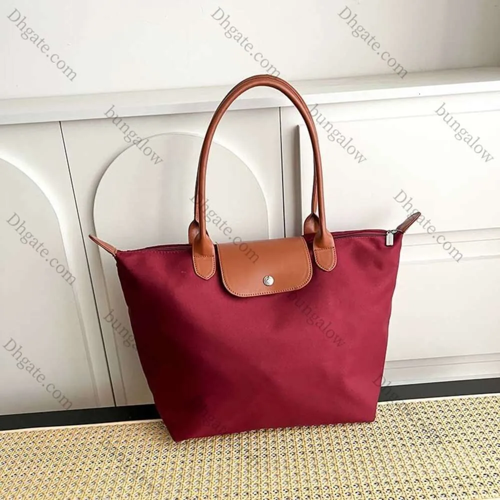 2024 Sac de designer Sac de designer de luxe Sac à main pour femme Sac à provisions Un sac à bandoulière Sac mère Sac fourre-tout de grande capacité Sac de plage 02