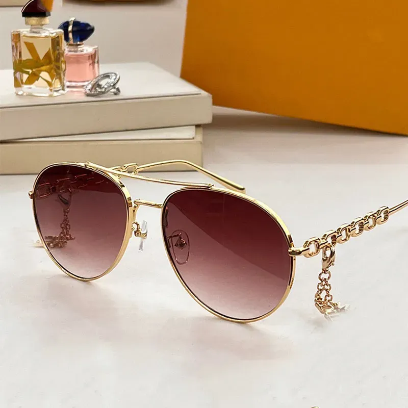 Designer luxurious elegant women metal chain policy sunglasses oval frame metal chain linked mirror legs with letter floral decoration travel and vacation Z1539W