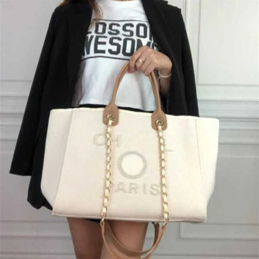 % 70 Fabrika Çıkışı Kapalı Kadınların El Tuval Plaj Çantası Tote Çanta Klasik Büyük Sırt Çantaları Kapasite Küçük Zincir Paketleri Büyük Crossbody Hub'lar Satışta