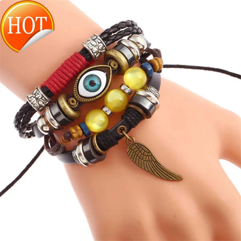 Charmarmband Multi Layer Woven Poaded Eye Alloy Wings Cowhide Armband Punk äkta läder