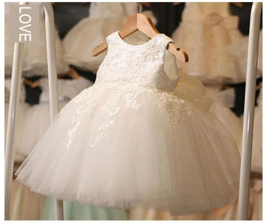 أبيض أول فساتين بالتواصل للبنات 2016 العلامة التجارية Tulle Lace Infant Toddler Pageant Flower Girl Fress لحفلات الزفاف وعيد الميلاد 1415509