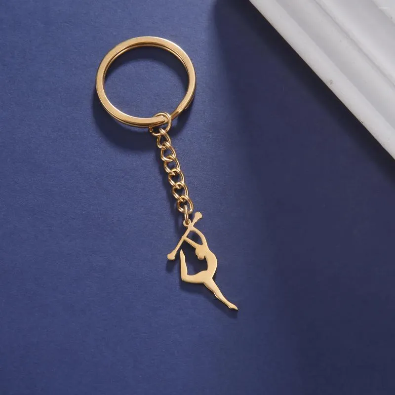 Nyckelringar Figur Gymnastik Key Chain Rostfritt stål Elegant Sports Stick Post Pendant Exklusiv kvinnamyckespresent till Sportsman