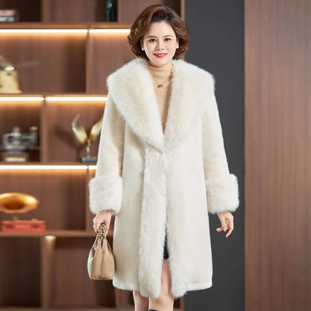 Haining Winter Fur New Women's intégré avec un tempérament amincissant et allongé.Manteau Vison Grande Taille 2423 nd