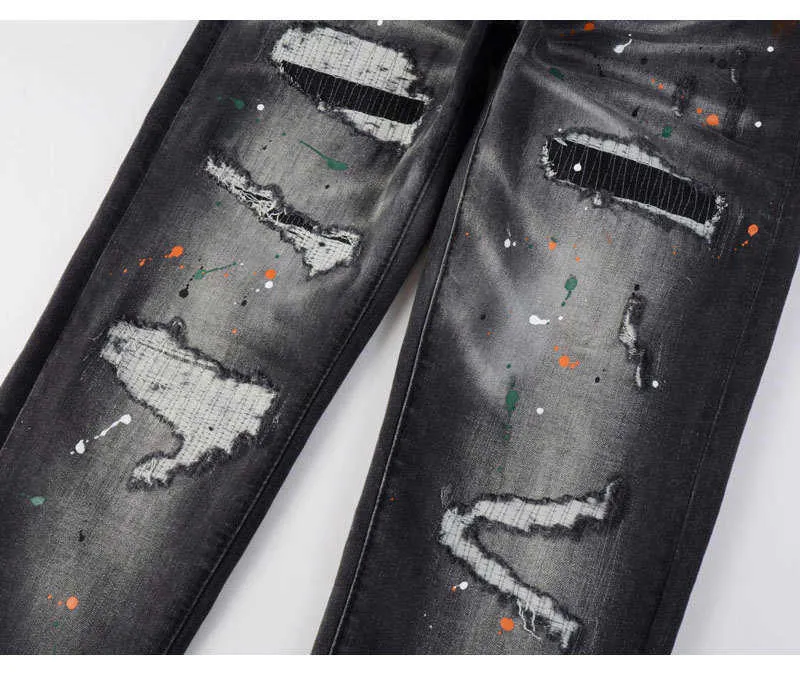 Jeans slim fit da uomo con ricami in nero e grigio_voghion.com