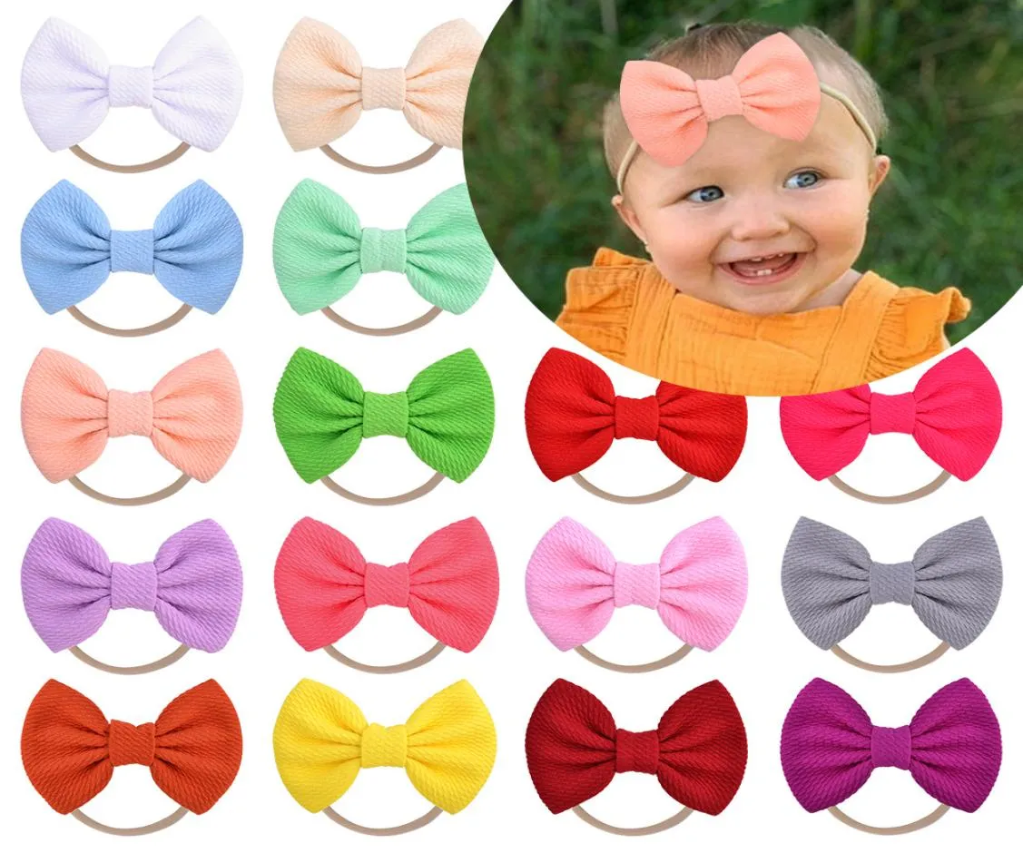 Fasce per capelli con fiocco in nylon per neonate Fascia per capelli solida Accessori per capelli per bambini Fasce per capelli elastiche con fiocco Bowknot Copricapo KHA1305072805