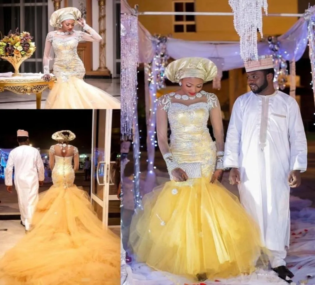 Традиционные африканские свадебные платья Нигерийские золотые свадебные платья 2020 года с хрустальными бусинами из прозрачного тюля с длинными рукавами Свадебное платье русалки Pl8525431