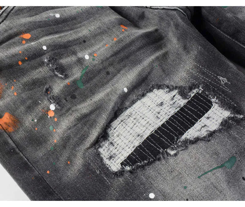 Jeans slim fit da uomo con ricami in nero e grigio_voghion.com