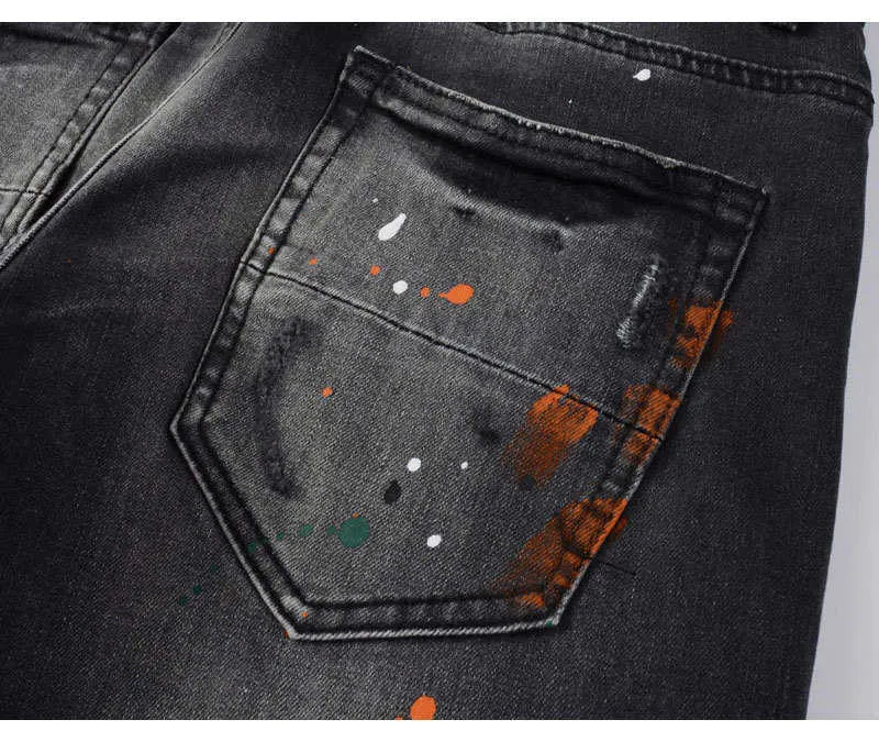 Jeans slim fit da uomo con ricami in nero e grigio_voghion.com