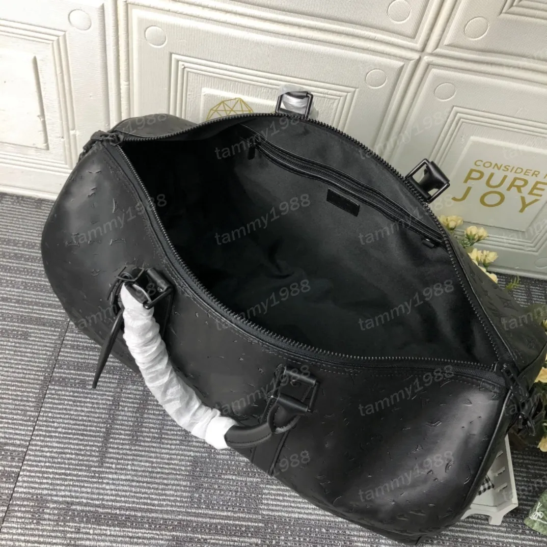 Duffel Bags Klassiker 50 cm Reisegepäck echtes Leder hochwertige Totes Umhängetaschen Herren Frauen Handtaschen 10A Duffel Bags Schatten geprägter graue Buchstaben 46117