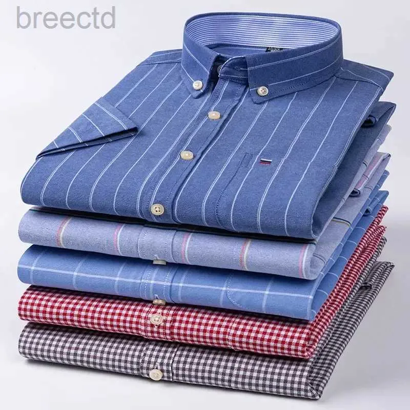 Polos pour hommes nouvelle chemise sociale à manches courtes pur coton doux boutonné vêtements à carreaux chemise surdimensionnée de grande taille ldd240312