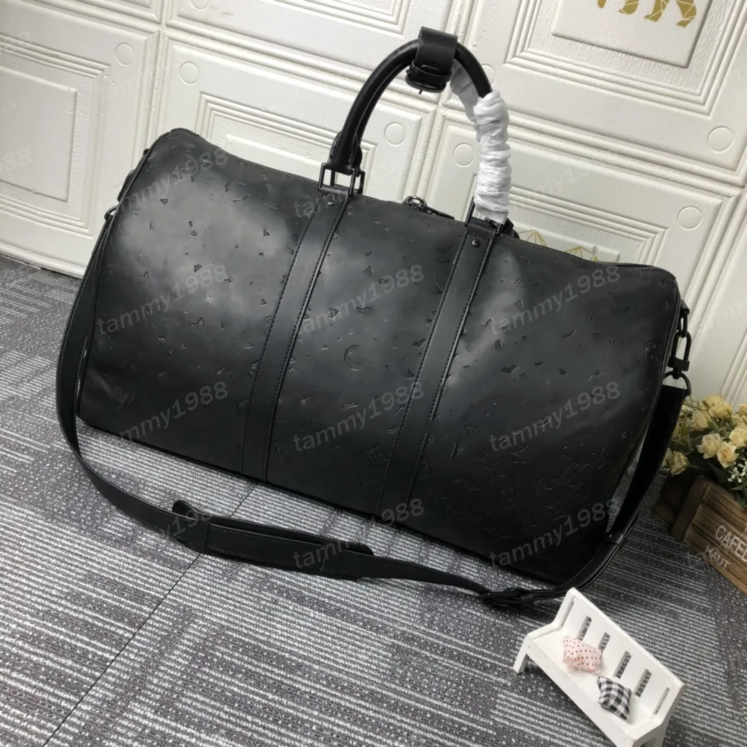 Duffel Bags Klassiker 50 cm Reisegepäck echtes Leder hochwertige Totes Umhängetaschen Herren Frauen Handtaschen 10A Duffel Bags Schatten geprägter graue Buchstaben 46117