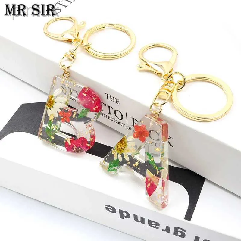 Keychains Lanyards Real Dried Flower 26 Initial Letter Keychain Exquisite Crystal Resin A-Z English Alphabe Charm Keyring Women Bag Key Accessories ldd240312