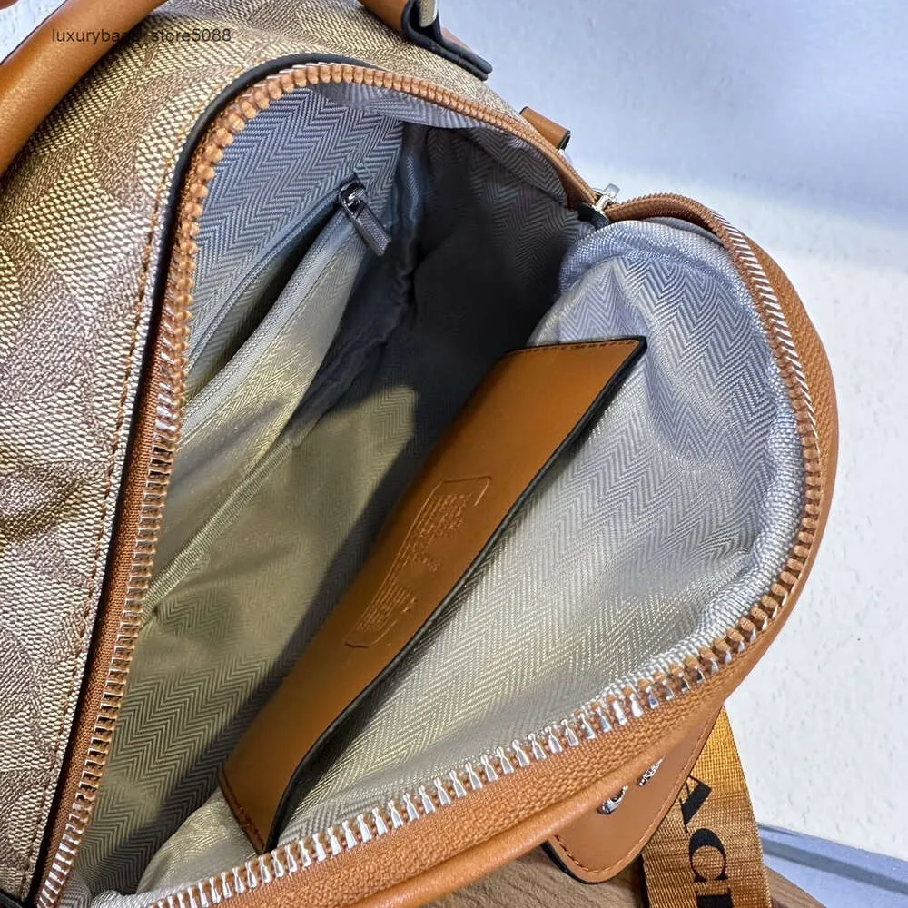 Pas cher en gros 50% de réduction sur les nouveaux sacs à main de créateur nouvelle mode sac à bandoulière diagonale ronde en cuir souple Mobile femme