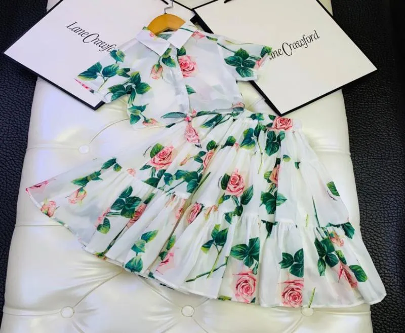 Baby Girls Flowers Suits Summer Kids Girls Krótkie koszule Rękaw z spódnicą 2PCS Zestawy księżniczki sukienki Dzieci Ubrania TOPS8123869