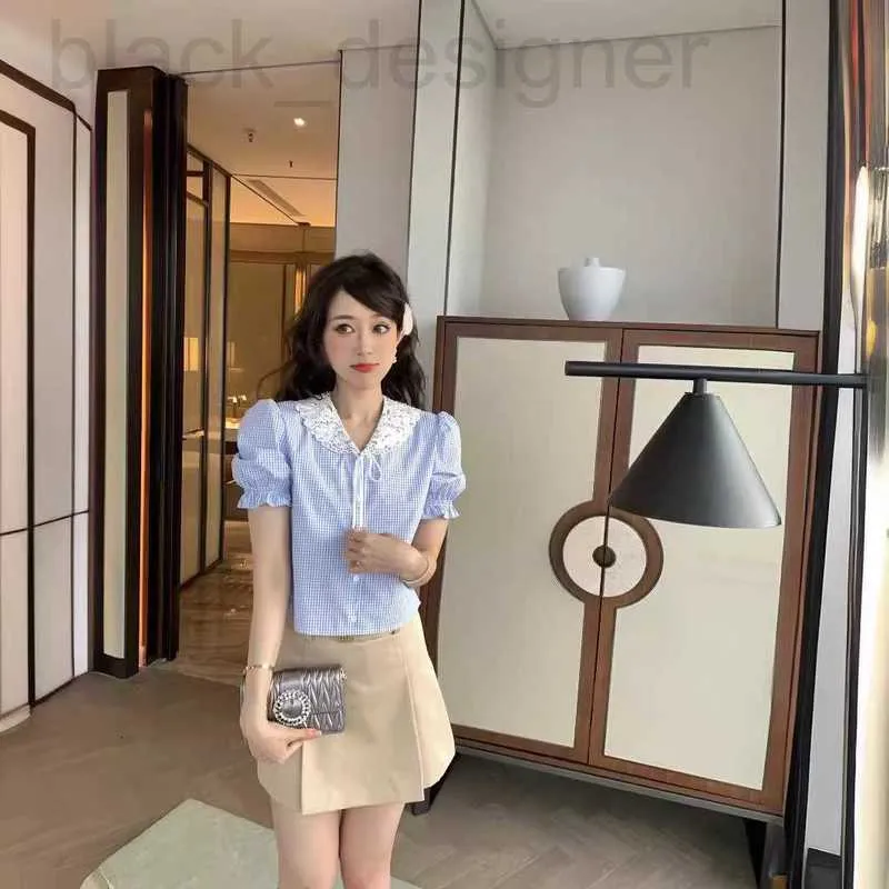 Polos pour femmes Designer Shenzhen Nanyou Haut de gamme Miu Accueil Creux Broderie Perles d'eau Diamant Décoration Bow Noeud Bulle Chemise à manches courtes TSHU