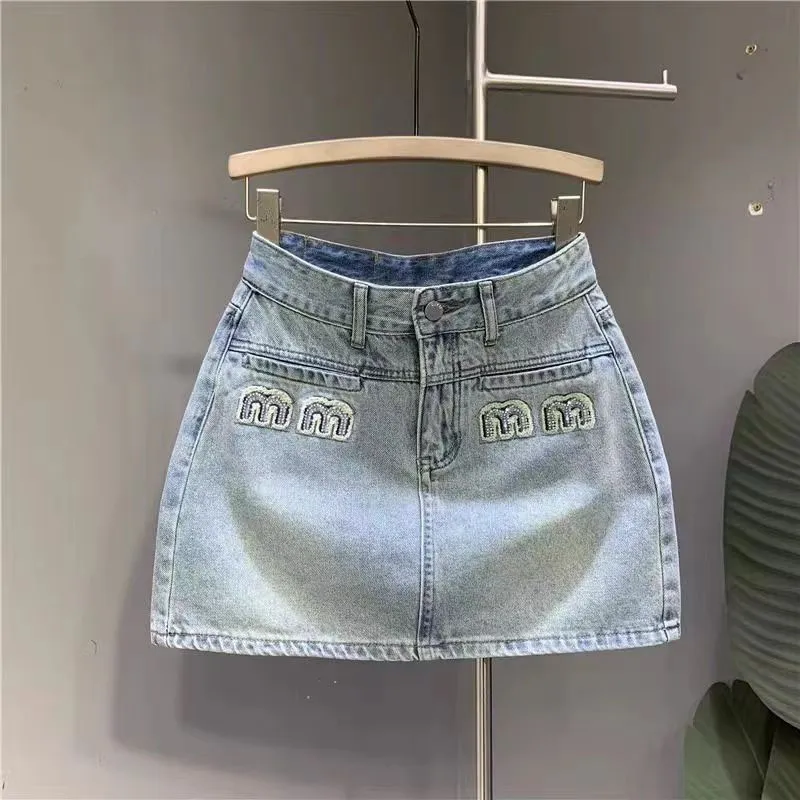 Modedesigner denim kjol designer kvinnor kjol rem hög midja slit mini kjol kvinnor sommar jeans kvinnors blå gata hemvist retro