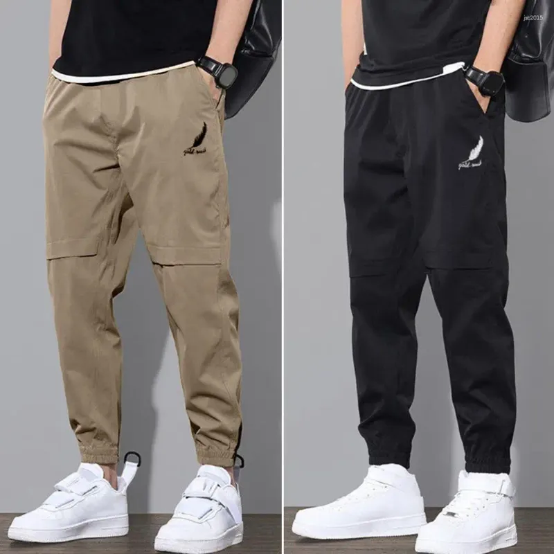 Herrbyxor vår- och höstmän i mitten av elastisk midjebandslogotryckfickor Solid färg Casual DrawString Sweatpants Streetwear