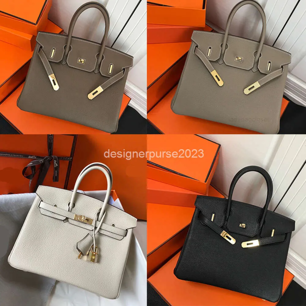 Bolso Lady Togo Bolsos de cuero clásicos para mujer Tote de diseñador Patrón de lichi de mano 30 cm Hebilla Cueros Cabeza Elefante Gris Marrón dorado GGQC PIIS