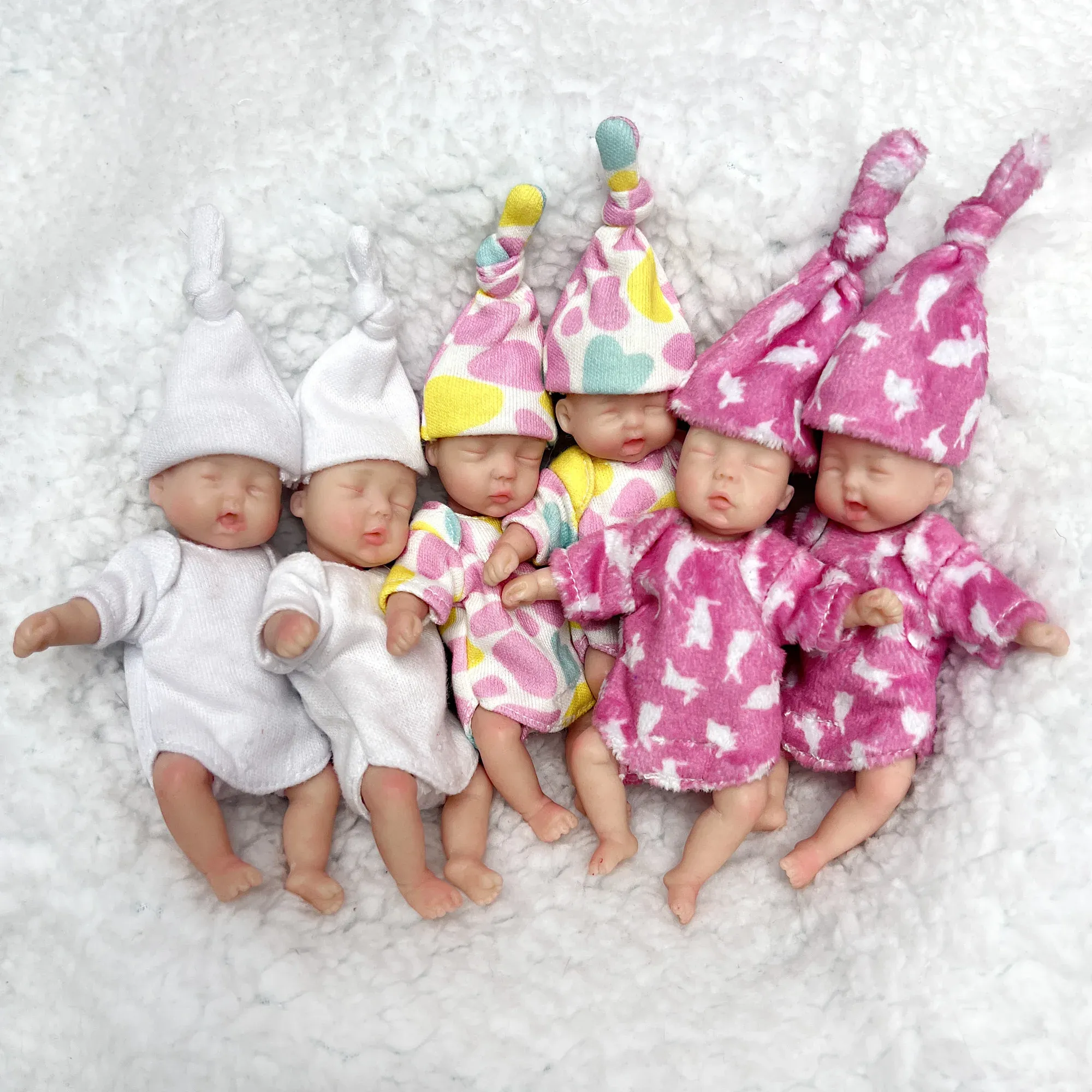 Poupées 10 cm Mini paume souple pleine Silicone solide Bebe Reborn fille avec deux ensembles tenues à la main câlin réaliste Reborn poupées