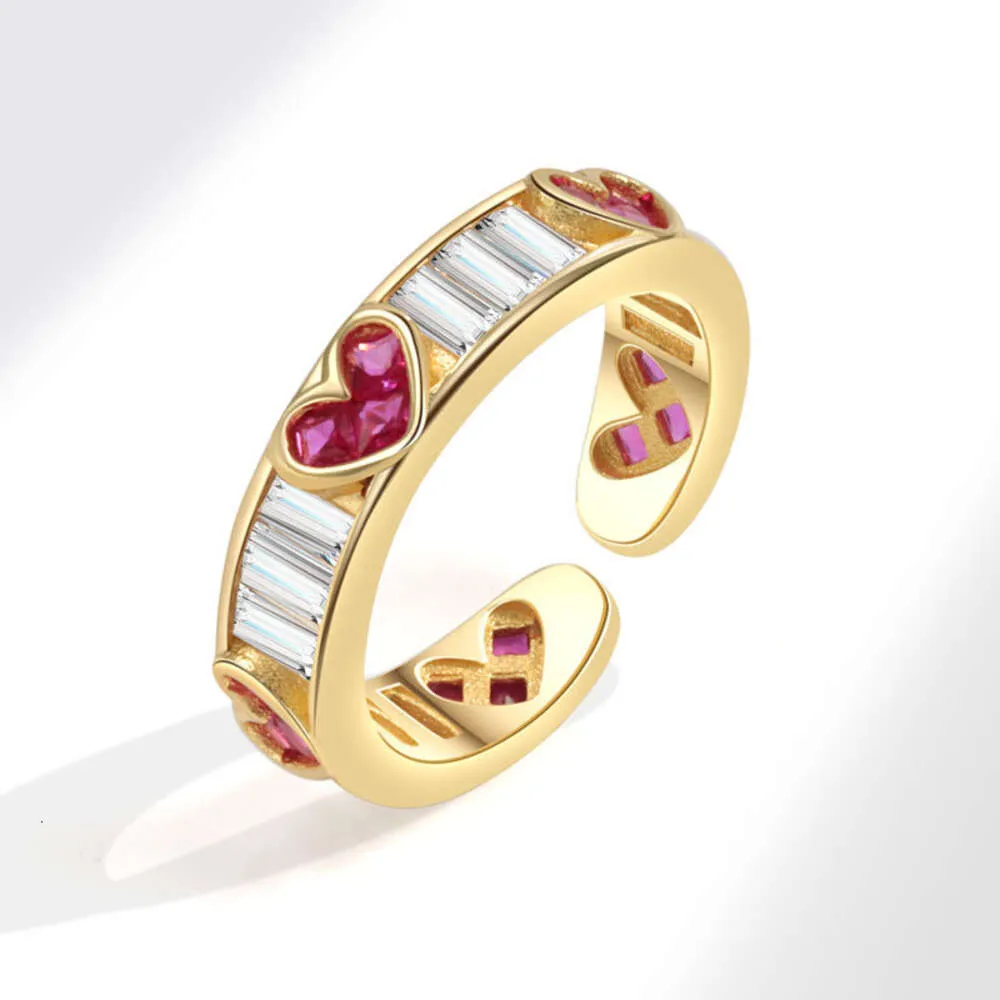 Nuevo diseño de nicho con circonitas doradas, apertura sencilla y anillo de amor de alta gama