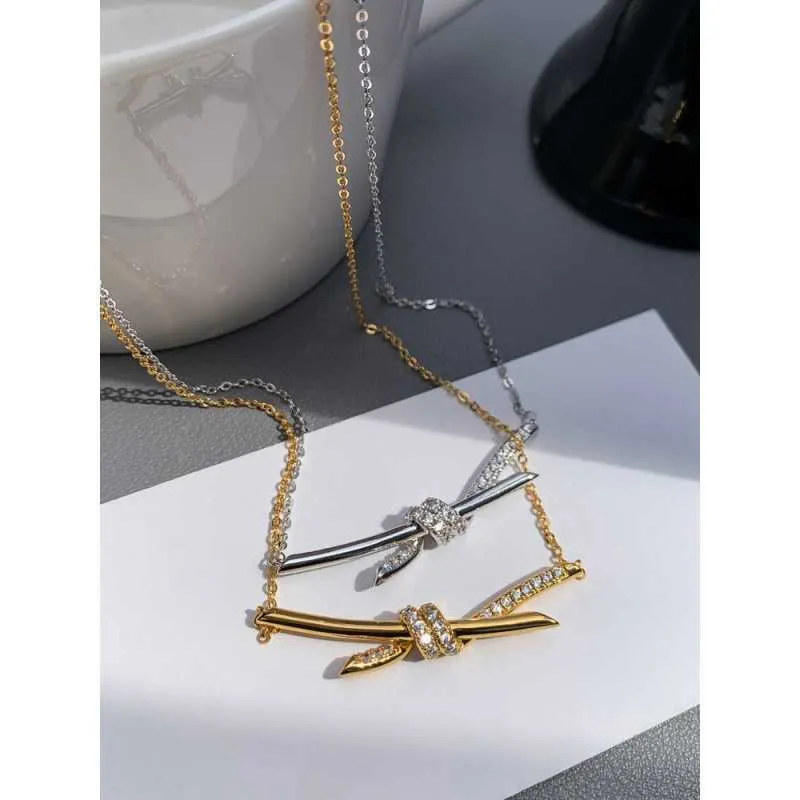 Designer Gu Ailings Cross Knot Necklace with the Same Style for Womens Light Luxury and Unique Design a High Grade Gold Elegance Celebrity Collar Chain