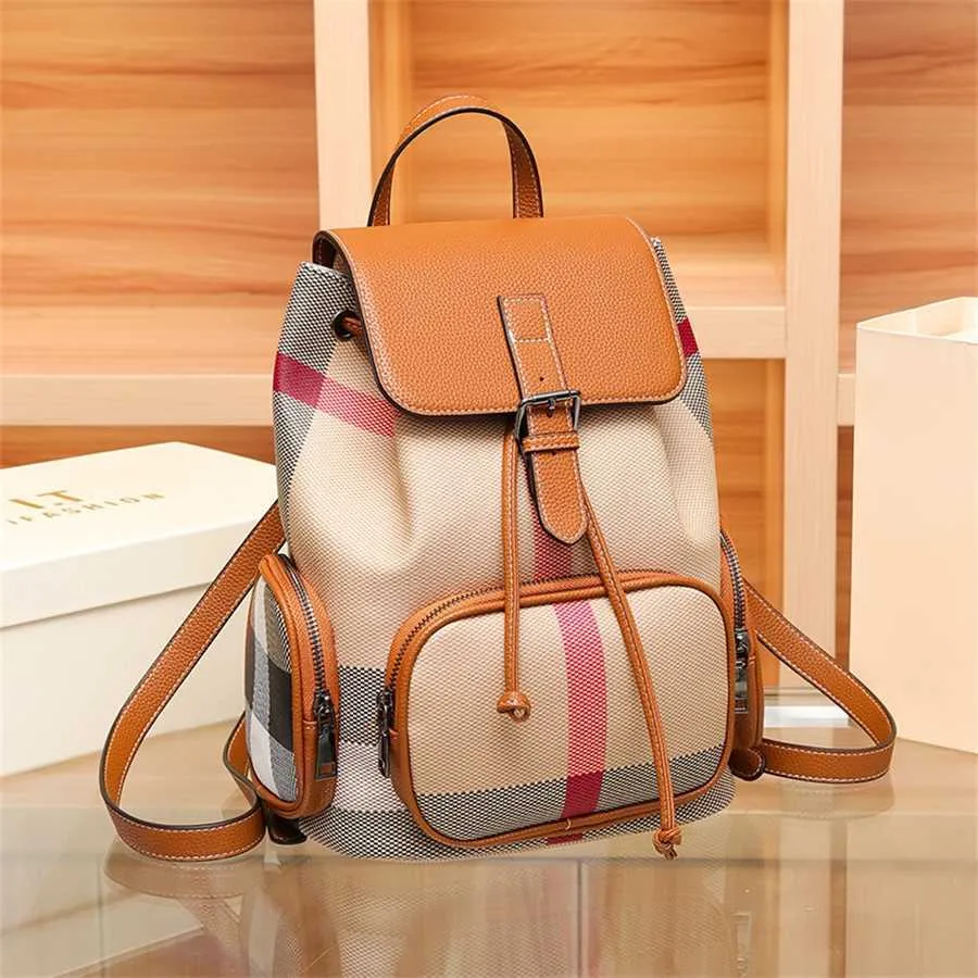 55% de desconto em vendas on-line Mochila xadrez de couro genuíno feminino clássico high-end internet famoso ao ar livre