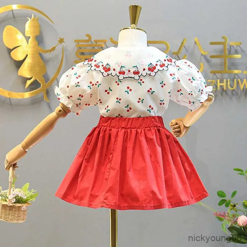 Ensembles de vêtements Été nouvelle fille vêtements costume brodé cerise dentelle revers haut + taille élastique jupe deux pièces bébé enfants costume vêtements pour enfants