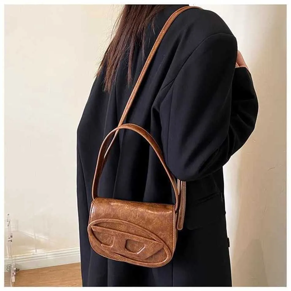 fine versione coreana della nuova borsa ascellare piccante per ragazza a tracolla con uno sconto del 60% nel negozio online