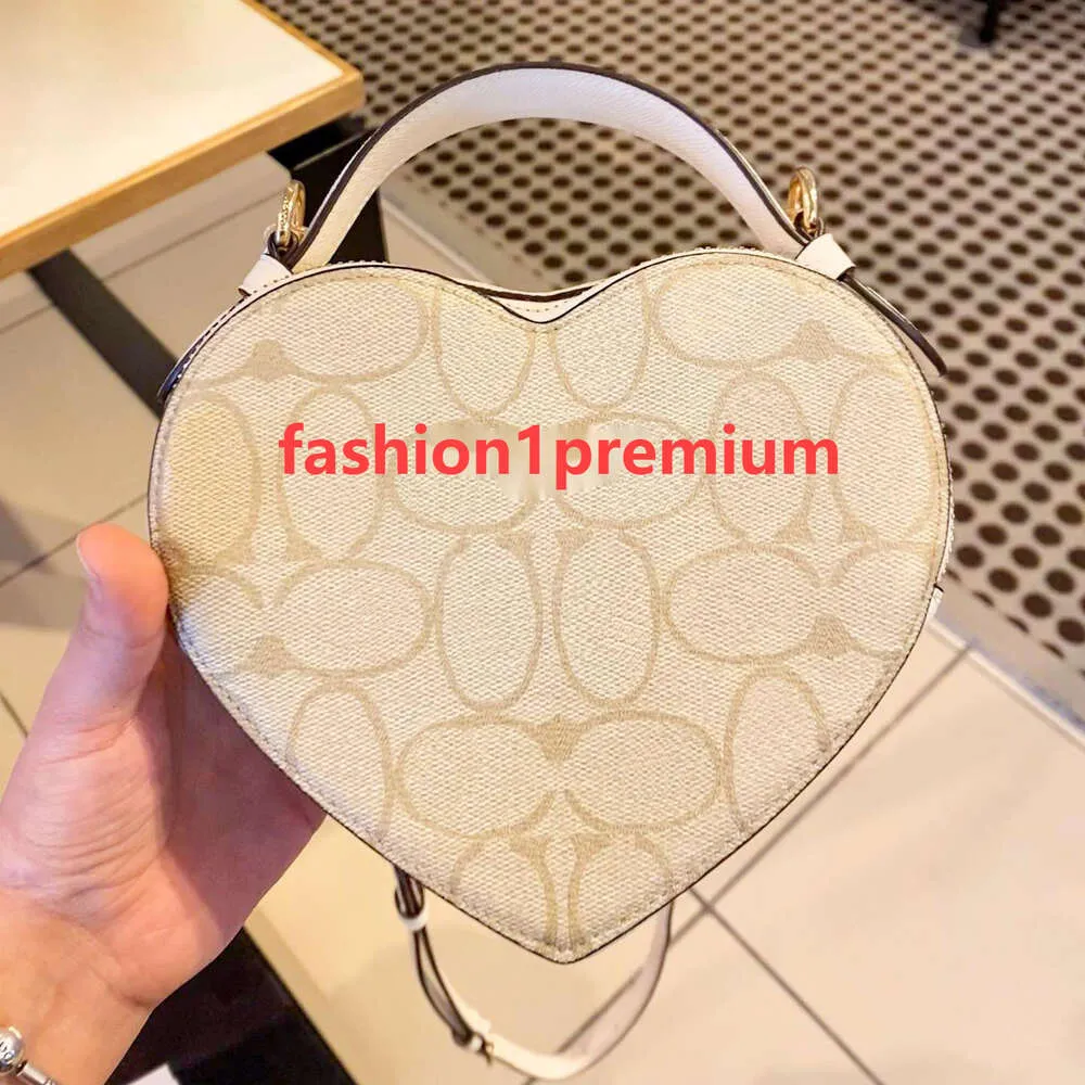 En kaliteli tote crossbody akşam sacoche kalp torbası debriyaj eyer orijinal deri lady lüks çanta tasarımcı çanta kadın çantalar erkekler vintage sling omuz çantaları