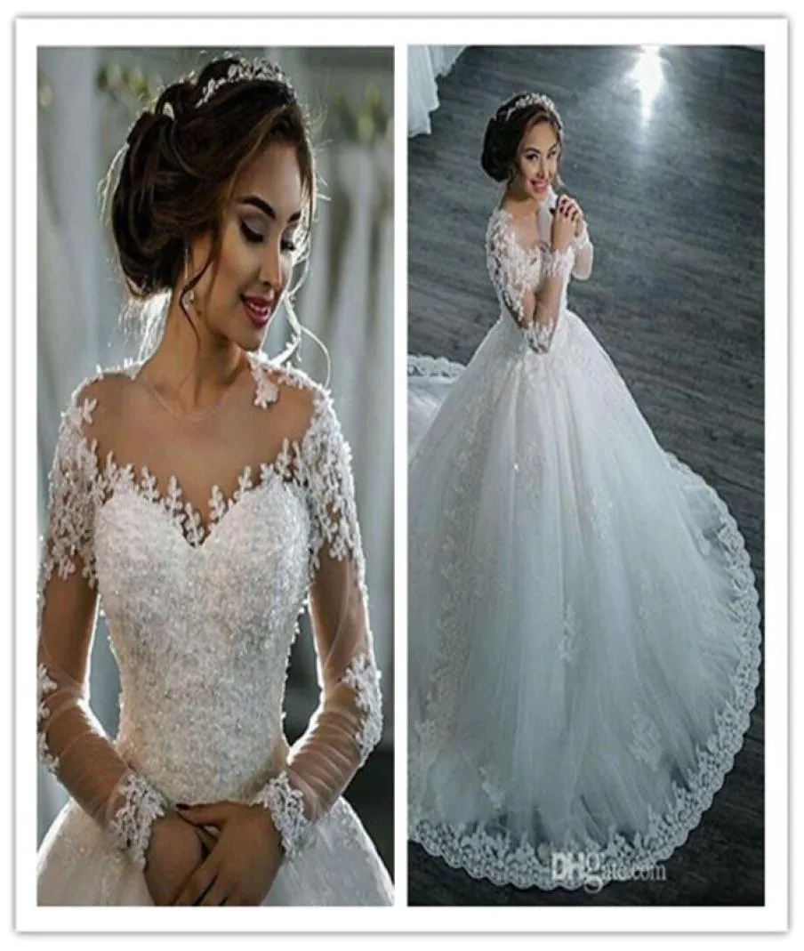 2021 Nya Dubai eleganta långa ärmar Aline Wedding Dresses Sheer Crew Neck Lace Appliques Pärlade Vestios de Novia Bridal klänningar Wit4107970