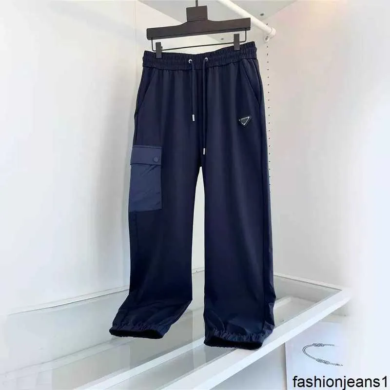 Designer Versione alta Primavera e Autunno Nuovo P Home Striscia di gomma da uomo Pantaloni con protezione per i piedi Triangolo Etichetta Pra Home Pocket Pantaloni casualC8OY