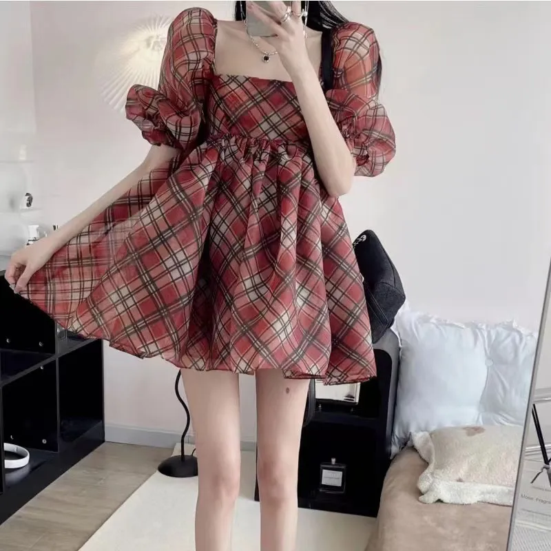 Women's four red plaid dress with square neckline, bubble sleeves, waistband, and fluffy skirt