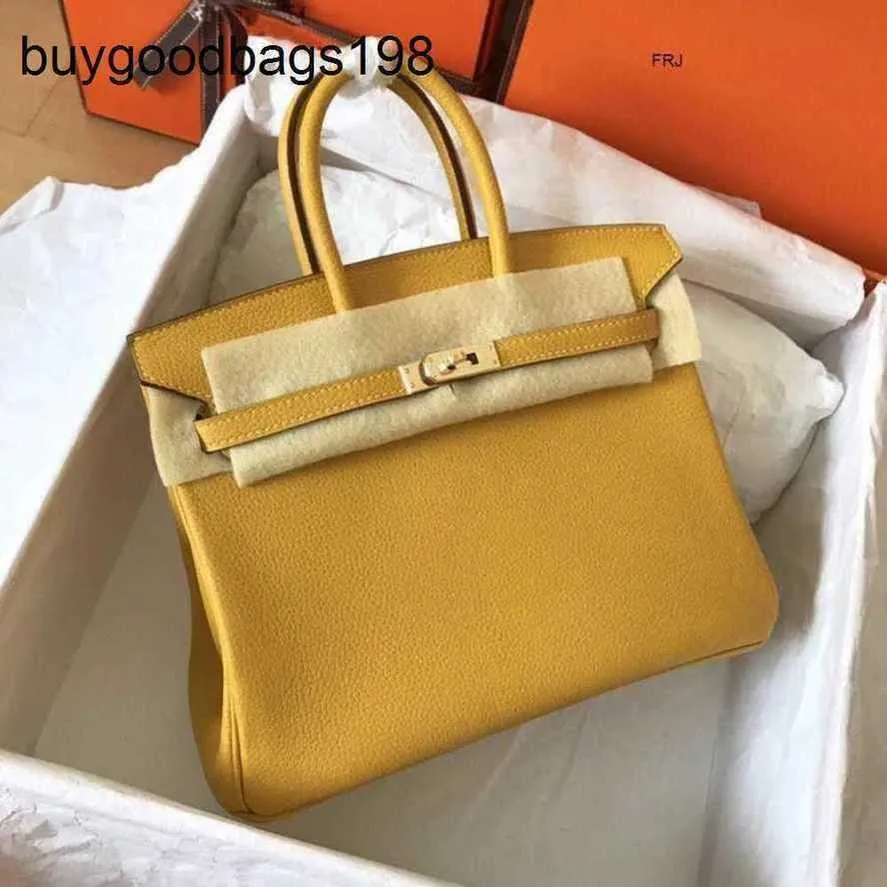 Designer sacos mulheres bolsas sacola 2024 novo estilo família lichia padrão togo couro cera thread costura noivas botão de bloqueio mão tem logotipo a27y