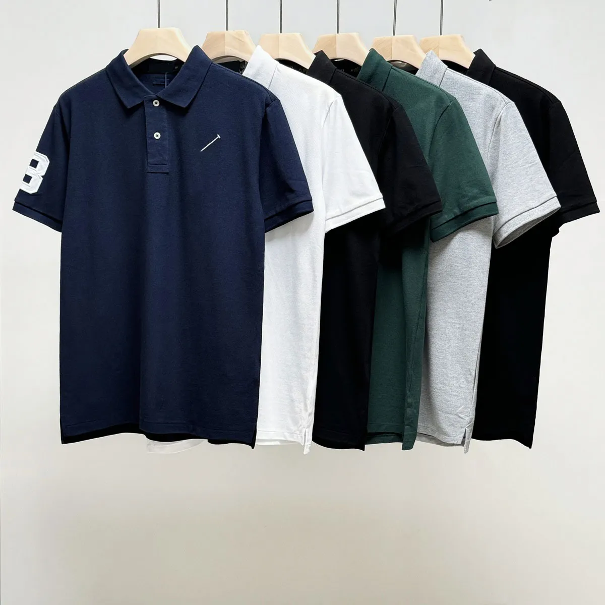 Polo da uomo di marca 2024 Polo con risvolto ricamato malese con maniche corte Tops Tees varsity golf Abbigliamento casual Strade Camicetta corta S-XXL