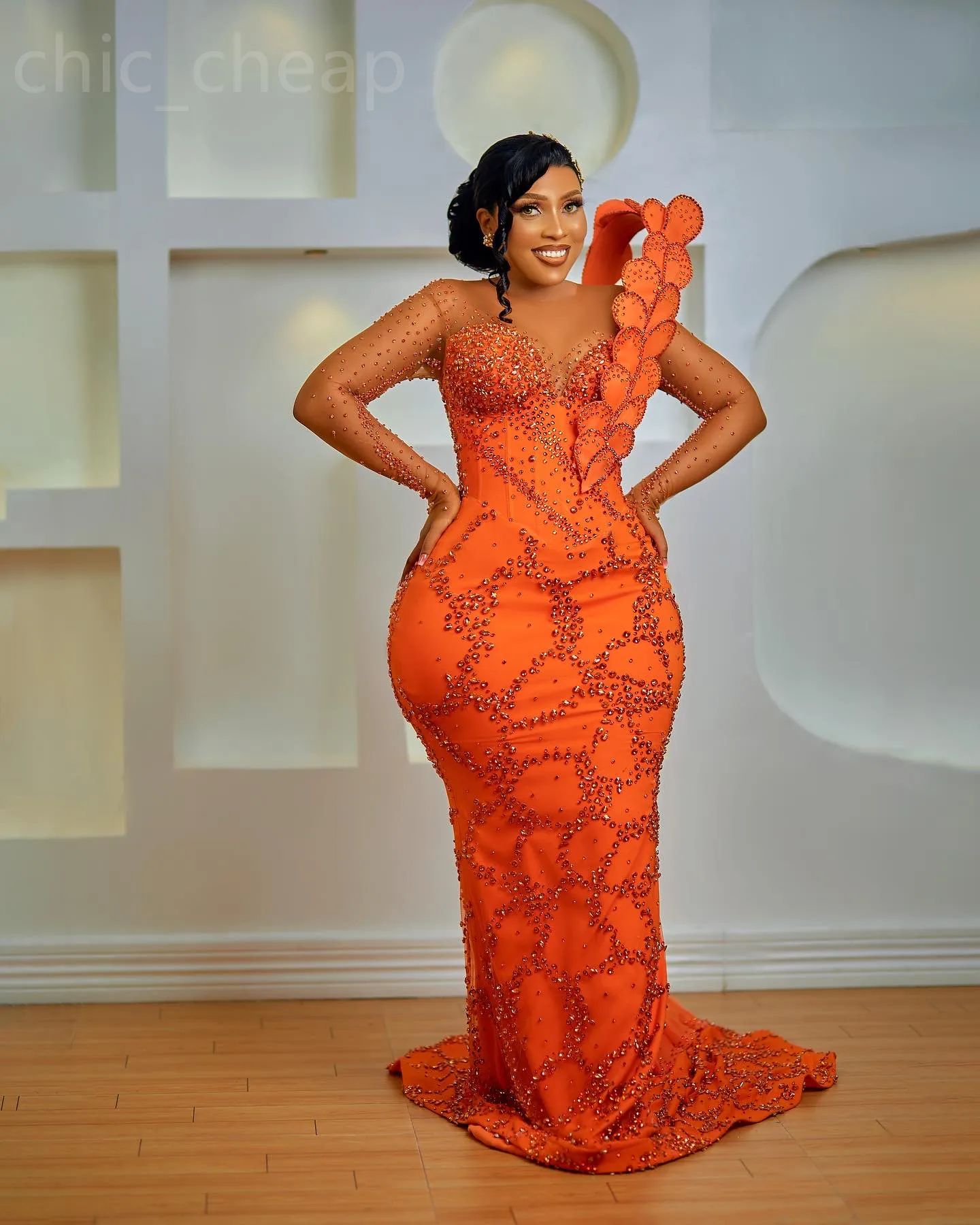 Orange Floral Mermaid Prom Dress with Beaded Crystals, Sequined Fabric, Jewel Neckline, and Lace-up Back Orange Floral Mermaid Prom Dress with Beaded Crystals, Sequined Fabric, Jewel Neckline, and Lace-up Back