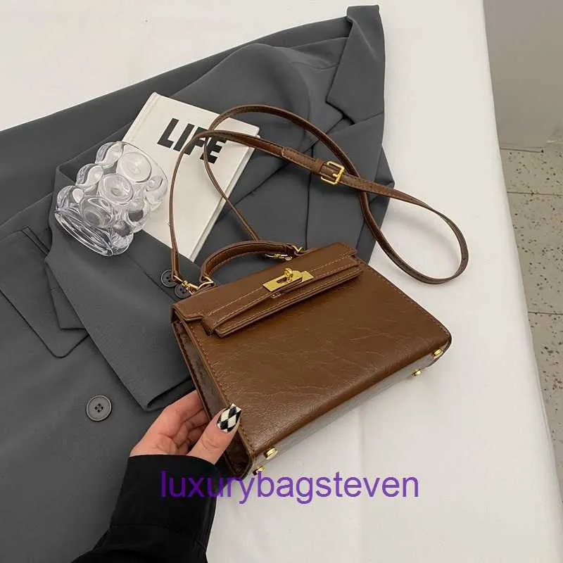 Lyxiga Hremms Kelyys Desingner Fashion Womens Totes Handväska vindstruktur Ny bärbar handväska med kohudens topplager och oljeläder med riktig logotyp