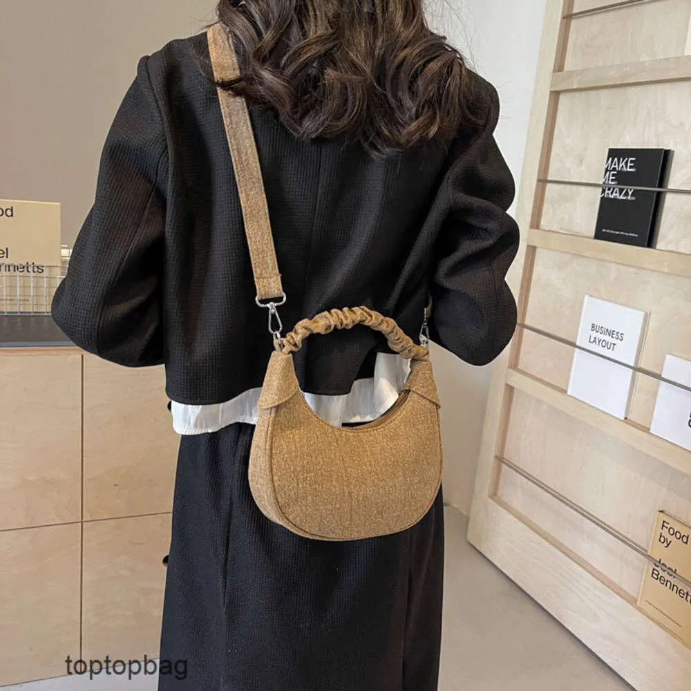 Designer Luxury fashion Shoulder bags Korean Folded Handheld Womens Bag 2024 New Crescent Bag Sweet and Versatile Single Shoulder Crossbody Womens Bag