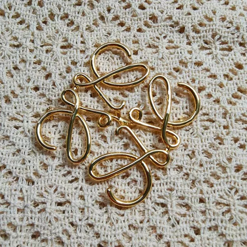 loewve brooch hollow simple lines twist flower love meaning personalized fashion exaggerated brooch