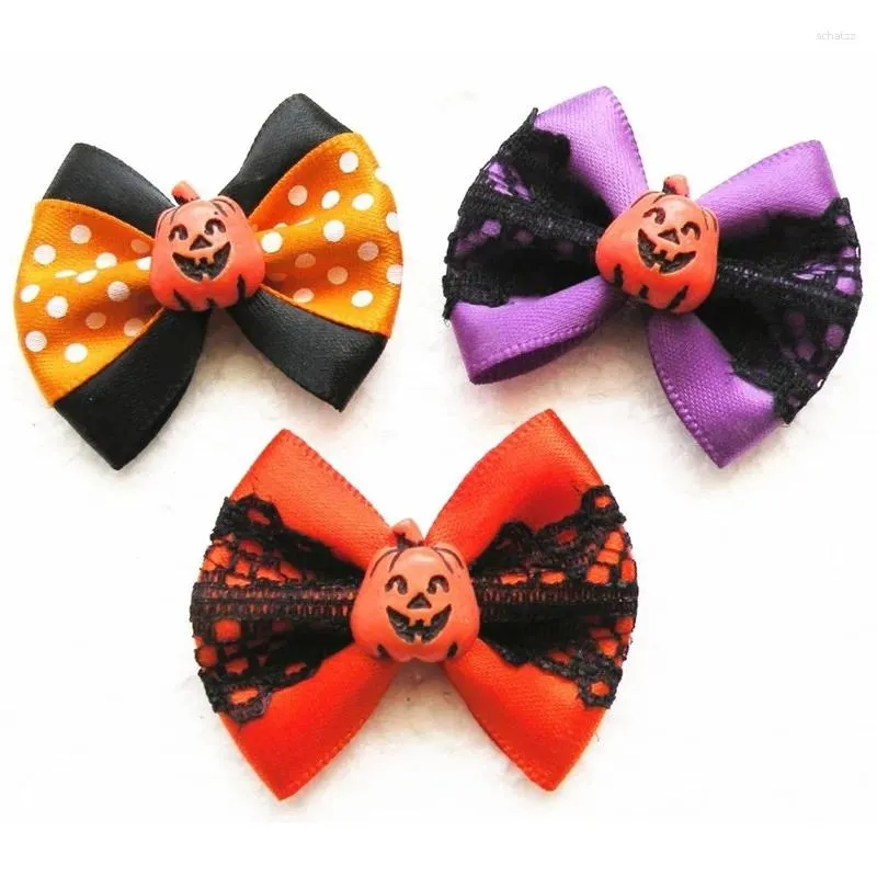 Appareils pour chiens 100pc / lot Halloween Bows Pumpkin en dentelle de toiletage Bands élastiques accessoires pour animaux de compagnie