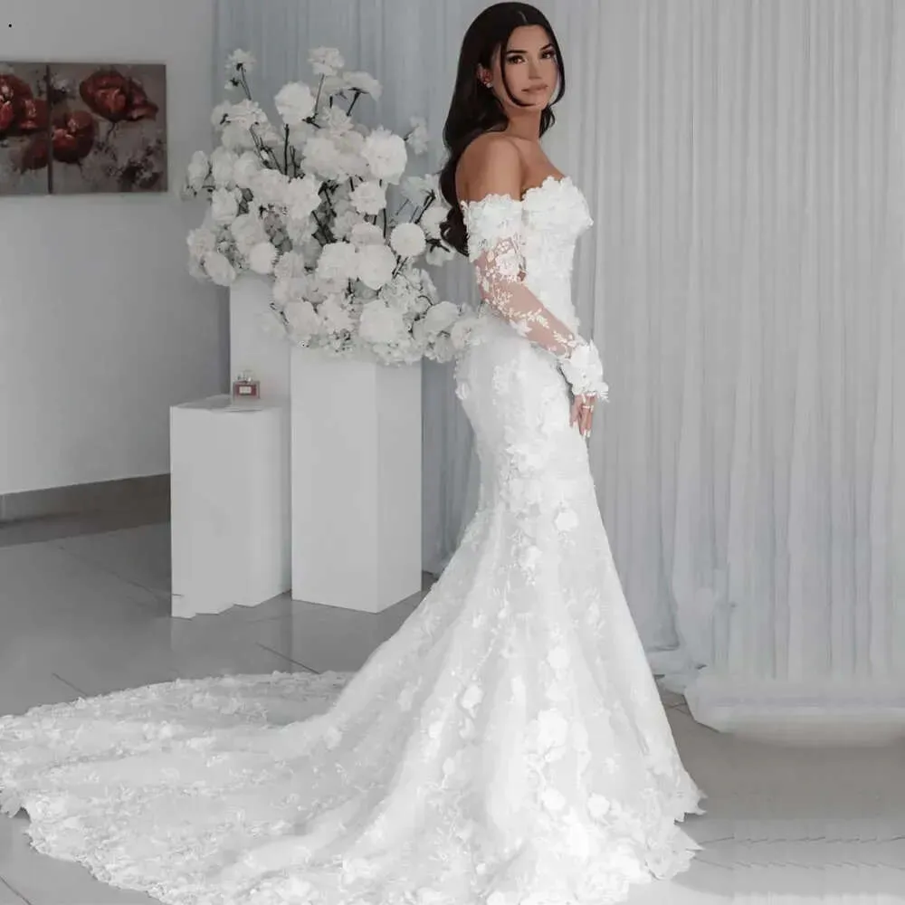 Splendidi abiti da sposa a sirena in pizzo eleganti con spalle scoperte maniche lunghe trasparenti applicazioni abiti da sposa flora 3D realizzati su misura