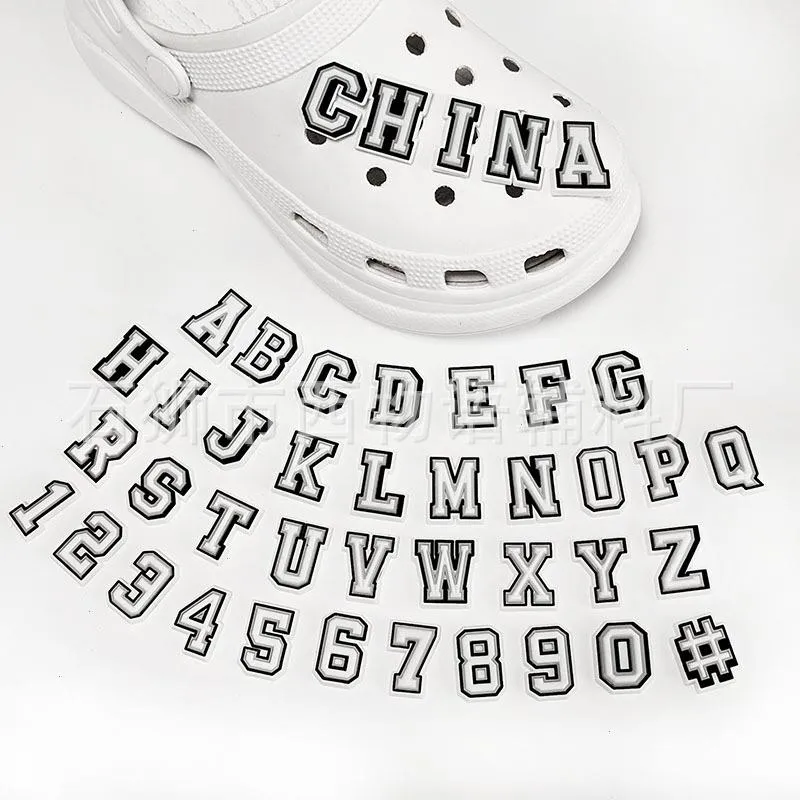 Anime charms wholesale childhood memories black alphabet mumber funny gift cartoon charms shoe accessories pvc decoration buckle soft rubber clog charms